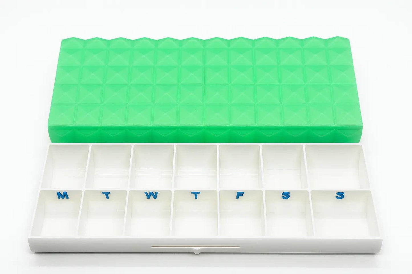 Diamond texture duo pill case for twice-daily medication organization.