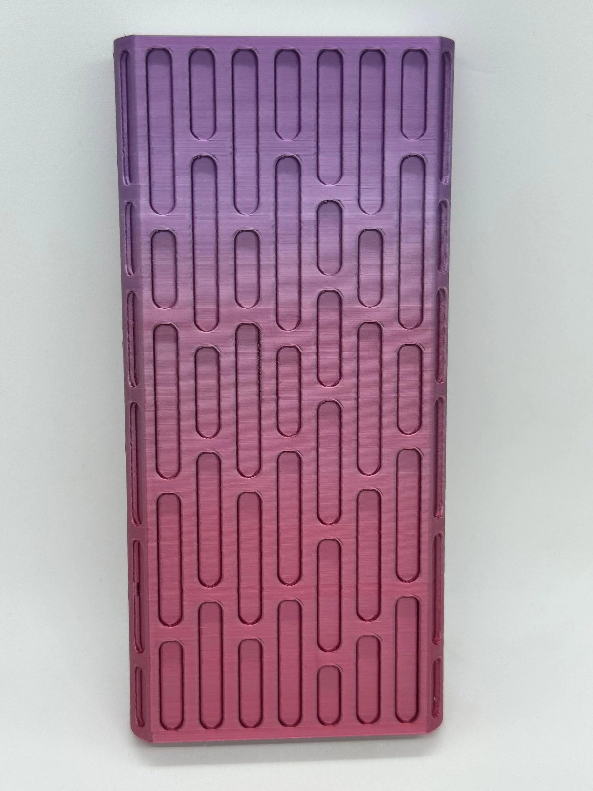 Brick texture duo pill case for twice-daily medication organization.