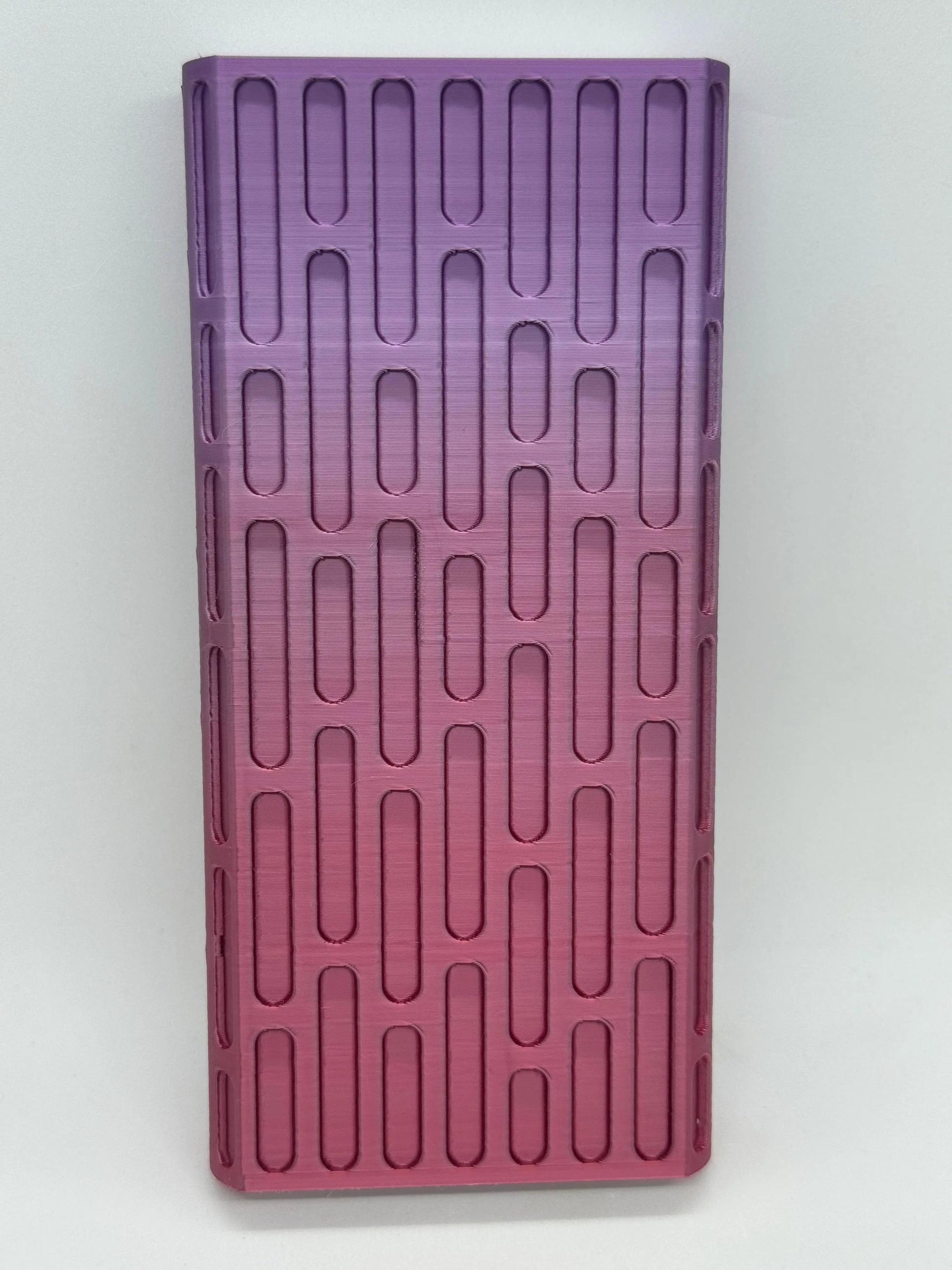 Brick texture duo pill case for twice-daily medication organization.