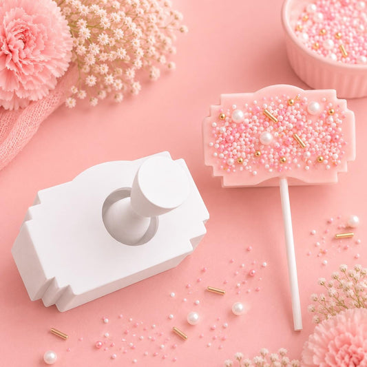 Vintage ticket cake pop mold with matching press tool and decorated vintage ticket cake pops.