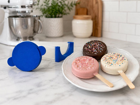 2-inch circle cake pop mold set with matching press tool, cutter and 6-inch tray.