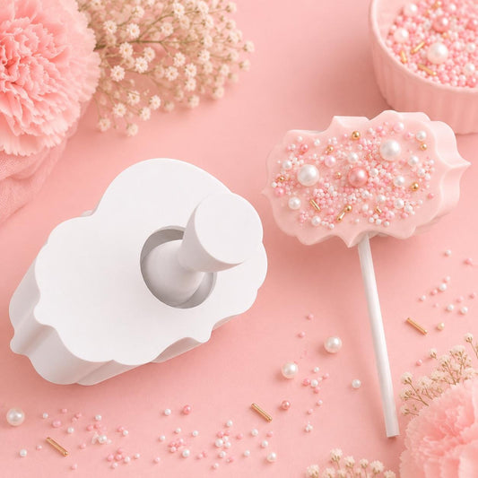 Scalloped rectangle cake pop mold with matching press tool and decorated scalloped rectangle cake pops.