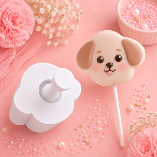 Dog face cake pop mold with matching press tool and decorated dog face cake pops.