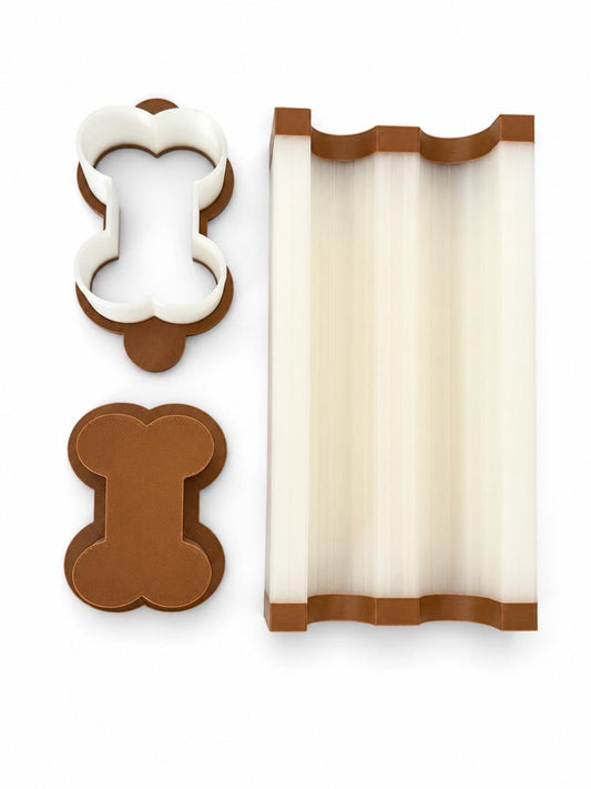 2-inch dog bone cake pop mold set with mold, press tool, cutter and 6-inch tray.